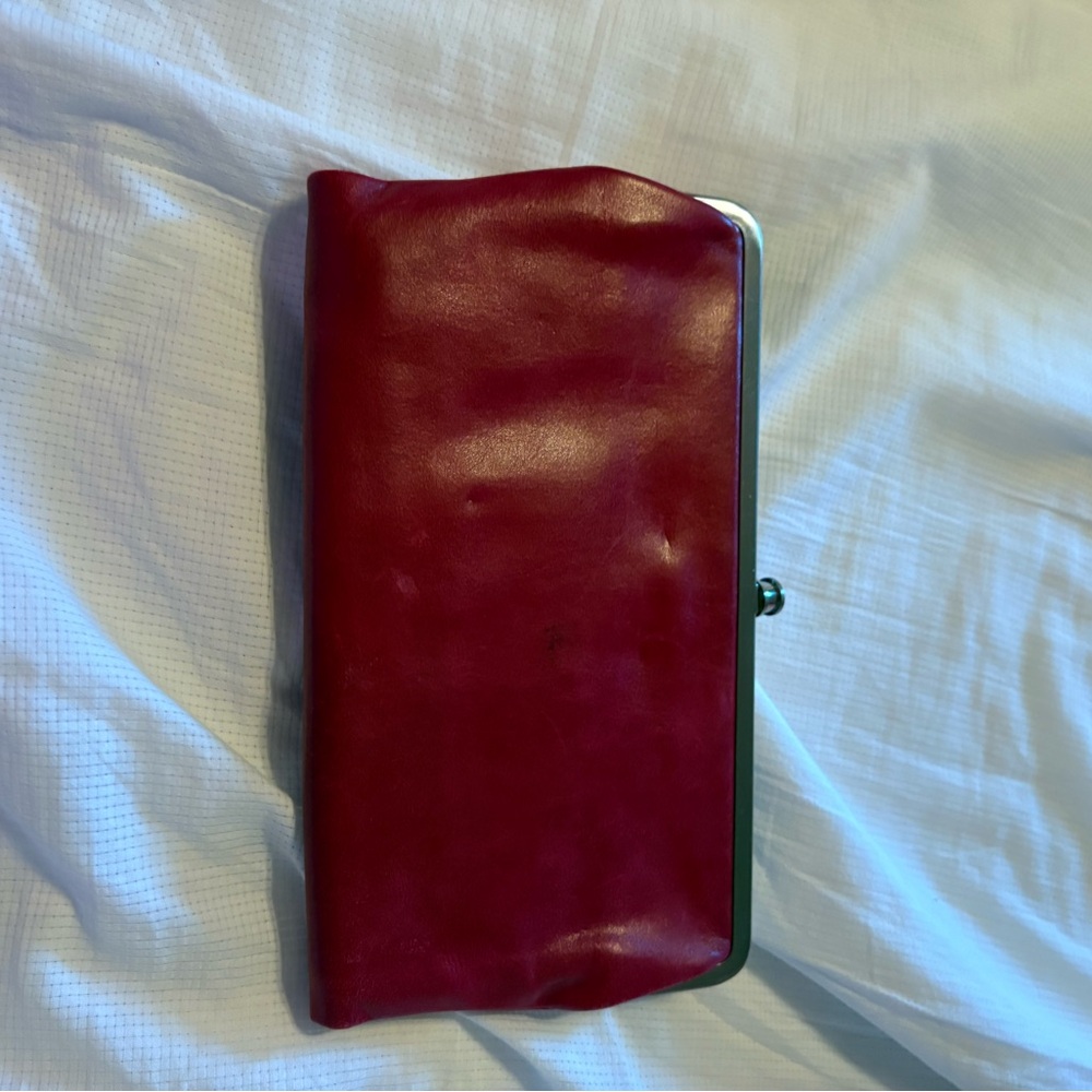 Leather hobo wallet in euc , raspberry red has some tint of pink as well.